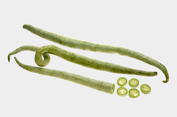 Three Snake Gourds five slices on white background