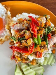 Rice topped with stir-fried pork and basil, Rice topped with stir fried minced pork and basil with Fried egg