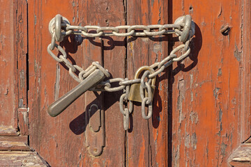 Chain With Padlock at Old House Door Gate Entrance