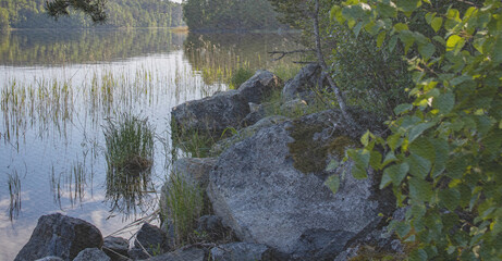 Body of water with a rock in the foreground