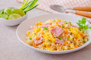 Fried rice with ham pork on white plate