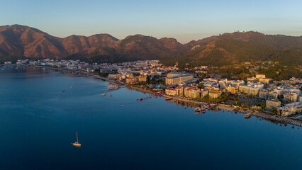 Drone aerial view of Marmaris and the mountains around during sunrise
