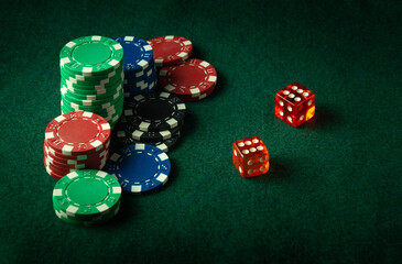 Dice with a lucky winning combination of two sixes on a green table in a poker club. A pleasant win depends on luck and fortune