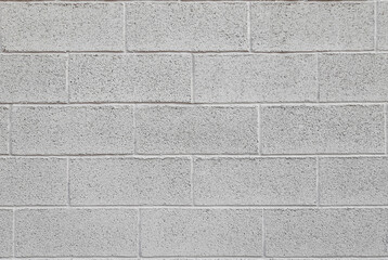 Mur en parpaings peints en gris
