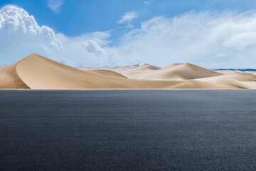 Empty asphalt road and desert dunes background © zhao dongfang