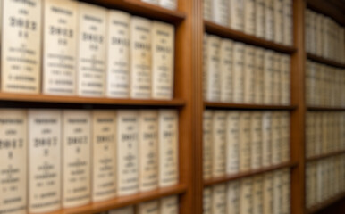 Blurred view of customer books on bookshelves
