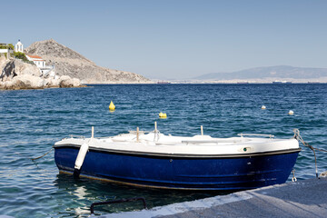 View of a wild beach and a boat on a sunny autumn day