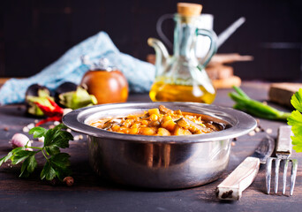 Vegetable stew. in metal bowl. Hot foodstuff.