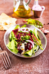 Tasty salad of beetroot, cheese and nuts. Copy space.