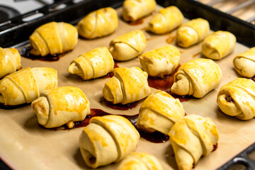 Crispy crescent rolls with jam. Dessert. Homemade croissants with jam © Denis