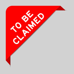 Red color of corner label banner with word to be claimed on gray background