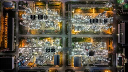 Aerial top view refinery plant of petrochemical Industry at night.