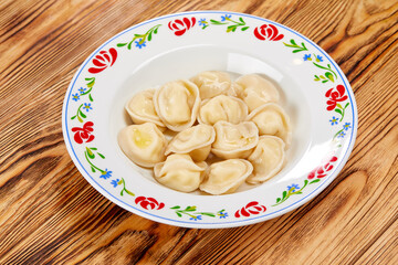 tasty dumplings on the wooden background