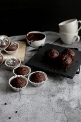 
chocolate cupcakes with chocolate chips.on a gray table.dessert