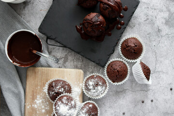 
chocolate cupcakes with chocolate chips.on a gray table.dessert