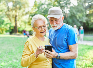 woman man outdoor senior couple retirement elderly phone fitness mobile smartphone music app communication active together love old nature using internet smart mature retired vitality healthy love
