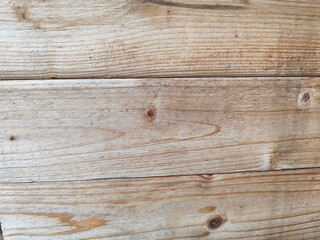 Fototapeta premium Close-up of old wooden planks with natural rough texture and visible wood grain.