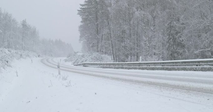Snowy Winter Roads - Heavy snowfall on a curvy mountain road - Lockdown shot