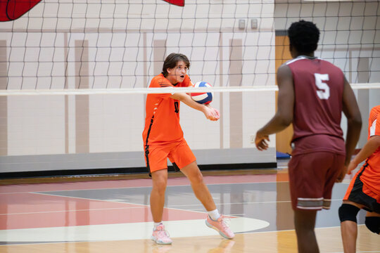 High School volleyball player passing the ball