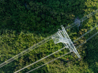 Aerial view of high voltage electricity tower on mountain