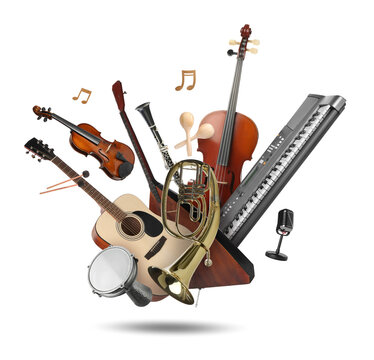 Different musical instruments in air on white