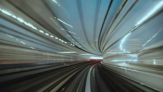 Vehicle traveling through tunnel with motion blur