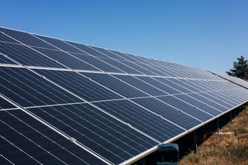 Large panels of sleepy batteries outside. Alternative electricity, green economy. Background with solar panels. Front view