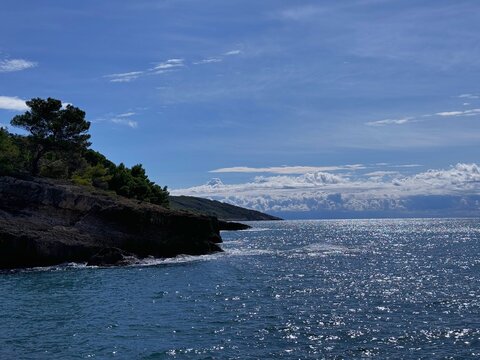 Blue sparkling sea and scenic rocky coast