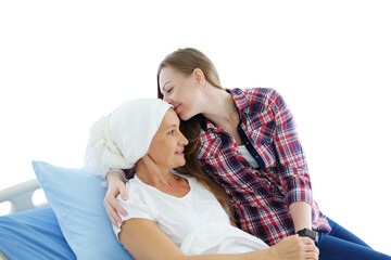 Smiling Caucasian daughter with elderly mother lying on a hospital bed and kissing together after...