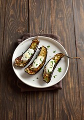 Baked aubergine with garlic yoghurt dressing