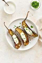 Oven roasted aubergine with garlic yogurt dressing