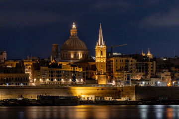 Valletta, Malta A night view of the skyline of the old town of Valletta,  Ball's Bastion, and the Cathedral dome.