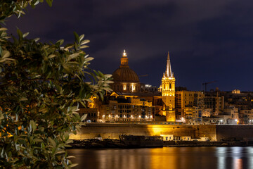 Valletta, Malta A night view of the skyline of the old town of Valletta,  Ball's Bastion, and the Cathedral dome.