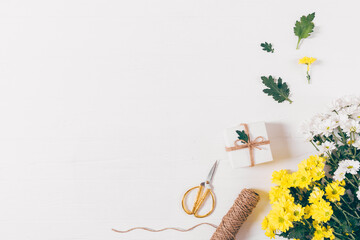 A white background with a box and scissors on it