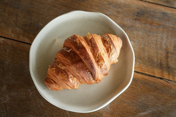 Croissant is a bread made from flour and butter and baked.