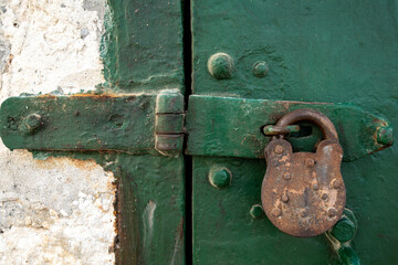 Valletta, Malta A green door and an old rusty padlock.