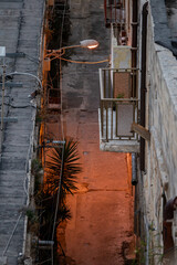 Valletta, Malta An old illuminated street at night with no people in the Old City of Valletta.