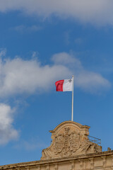 Valletta, Malta  A Maltese Flag flies above an official building.