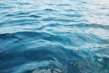 Emerald green waters and turquoise surface of blue sea wave and water background. Travel destination summer of ocean