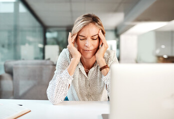 Stress, headache and business woman on laptop in office with tension, migraine and medical crisis. Professional, corporate and frustrated worker with head pain for fatigue, burnout and overworked