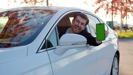 Man looks out of auto window showing car sharing application