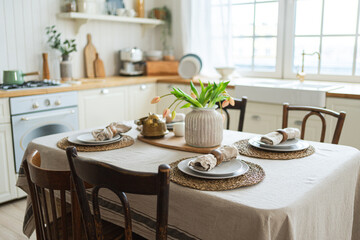 Scandinavian classic minimalistic kitchen with white and wooden details flowers. Modern white kitchen clean contemporary style interior design. Empty bright white interior minimal of kitchen