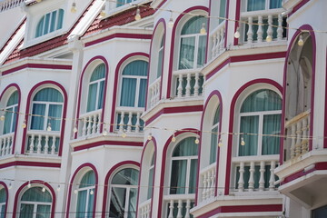 Fototapeta premium Detailed view of windows, doors and balconies of city buildings 