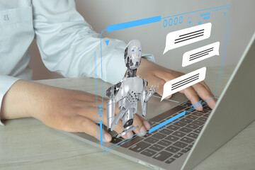 Businessman using laptop for Chat with AI, Artificial Intelligence Conversation,Digital Communication,AI Technology,Digital Assistant, Machine Learning concept.