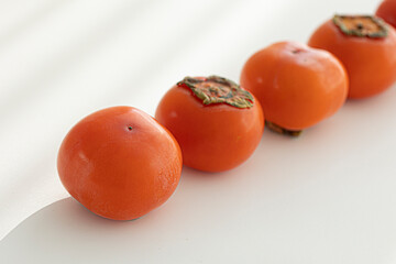 Fresh orange persimmon isolated on white background