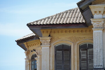 Fototapeta premium Detailed view of windows, doors and balconies of city buildings 