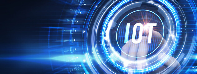 Internet of things - IOT concept. Businessman offer IOT products and solutions. The future of technology. Virtual screen of the future with the inscription: IOT.