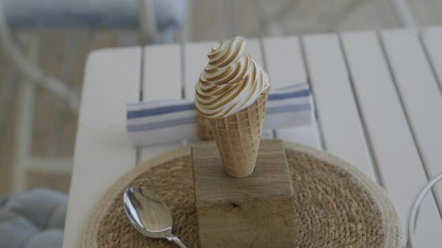 An softie in a cone on a dining table 