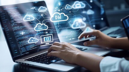 A person using a laptop with cloud computing graphics and data visualization.