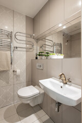 Bright Elegant Retro Classic Style Home Bathroom Interior Design With White Sink. Mirror and Faucet. LED Lights. Shower Area, Heater, Tile Floor and Walls